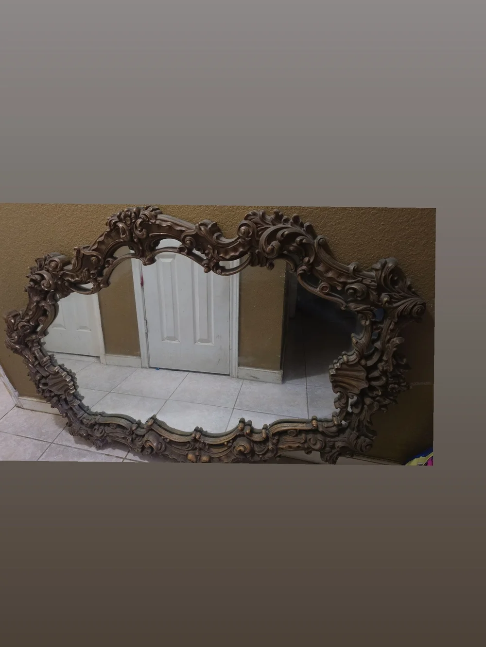 Ornate Carved Wall Mirror in Brown Finish